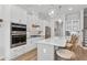 Bright kitchen features white cabinets, stainless steel appliances, granite countertops, and pendant lighting at 2120 Sonoma Se Dr, Smyrna, GA 30080