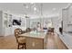 Modern kitchen with a large island, stainless steel appliances, and an open view of the living and dining areas at 2120 Sonoma Se Dr, Smyrna, GA 30080