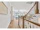 Bright and airy living room with a staircase, hardwood floors, and plenty of natural light at 2120 Sonoma Se Dr, Smyrna, GA 30080