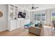 Living room features built-in shelves, recessed lighting, and hardwood floors at 2120 Sonoma Se Dr, Smyrna, GA 30080
