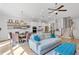 Bright living room boasts modern decor, an open floor plan, and a seamless transition into the dining and kitchen area at 2120 Sonoma Se Dr, Smyrna, GA 30080