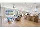An open-concept living space with a living room, dining area, and kitchen. Neutral tones and modern finishes throughout at 2120 Sonoma Se Dr, Smyrna, GA 30080