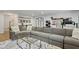 Bright living room features a large couch, exercise equipment, and an accent rug at 2120 Sonoma Se Dr, Smyrna, GA 30080
