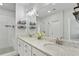 Well-lit bathroom featuring double vanity, modern finishes, and a glass-enclosed tiled shower at 2120 Sonoma Se Dr, Smyrna, GA 30080