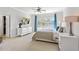 Main bedroom featuring neutral walls, carpet, and a large window with lots of natural light at 2120 Sonoma Se Dr, Smyrna, GA 30080