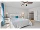 Bright main bedroom featuring modern ceiling fan, comfortable king bed, and ensuite bathroom at 2120 Sonoma Se Dr, Smyrna, GA 30080