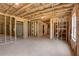 Spacious unfinished basement shows framing and insulation, waiting for your personal touch at 3298 Rangers Gate, Marietta, GA 30062