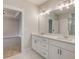 Well-lit bathroom featuring double vanity with white cabinets and spacious layout adjacent to the main bedroom at 3298 Rangers Gate, Marietta, GA 30062