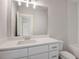 Bright bathroom features a white vanity with a quartz countertop and modern fixtures at 3298 Rangers Gate, Marietta, GA 30062