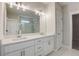 Bright bathroom with double sink vanity, quartz countertop, decorative lighting, and glass-enclosed shower at 3298 Rangers Gate, Marietta, GA 30062