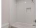 Bathroom featuring white subway tile and a shower with built-in niche at 3298 Rangers Gate, Marietta, GA 30062