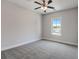 Bright bedroom with plush carpet, natural light from a large window, and neutral paint color at 3298 Rangers Gate, Marietta, GA 30062
