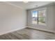 Bright bedroom with hardwood floors, large window, and neutral paint at 3298 Rangers Gate, Marietta, GA 30062
