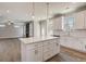 Bright kitchen boasts white cabinets, stone countertops, stainless appliances, and an open floor plan at 3298 Rangers Gate, Marietta, GA 30062