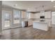Modern kitchen features white cabinets, hardwood floors, and stainless steel appliances at 3298 Rangers Gate, Marietta, GA 30062