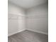 Empty walk-in closet with carpet and basic wire shelving ready for customization at 3298 Rangers Gate, Marietta, GA 30062