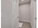 Passage into a walk-in closet featuring wood-look tile flooring and basic wire shelving at 3298 Rangers Gate, Marietta, GA 30062
