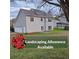 Spacious backyard with lush grass and a two-story house, offering a landscaping allowance at 79 Dogwood Ferry Ct, Lawrenceville, GA 30046