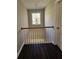Open hallway featuring modern lighting and dark hardwood floors at 79 Dogwood Ferry Ct, Lawrenceville, GA 30046
