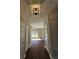 Hallway features hardwood floors and modern lighting at 79 Dogwood Ferry Ct, Lawrenceville, GA 30046