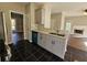 Modern kitchen features granite countertops, stainless steel appliances, and a breakfast bar at 79 Dogwood Ferry Ct, Lawrenceville, GA 30046