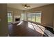Cozy living room with a fireplace and large windows overlooking the backyard at 79 Dogwood Ferry Ct, Lawrenceville, GA 30046