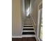 Stairway with wooden steps and a window, providing natural light to the entryway at 79 Dogwood Ferry Ct, Lawrenceville, GA 30046