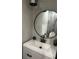 Chic bathroom with modern fixtures, round mirror, and stylish decor at 1031 Camilla Sw St, Atlanta, GA 30314
