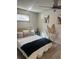 Inviting bedroom with plush bedding, neutral tones, and natural light from a window at 1031 Camilla Sw St, Atlanta, GA 30314