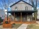 Charming craftsman-style home with a welcoming front porch and modern gray siding at 1031 Camilla Sw St, Atlanta, GA 30314