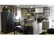 Charming kitchen features stainless steel appliances, a dining table, and pendant lighting at 1031 Camilla Sw St, Atlanta, GA 30314