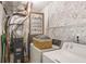 Laundry room with washer, dryer, utility sink, and ample storage space at 210 Woodcliff Dr, Atlanta, GA 30350