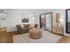 Comfortable living room featuring a plush sofa and sliding glass doors to balcony at 210 Woodcliff Dr, Atlanta, GA 30350
