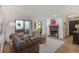 Well-lit living room features a fireplace and sliding glass doors to balcony at 210 Woodcliff Dr, Atlanta, GA 30350