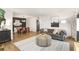 Spacious living space features sleek flooring and an open floorplan at 210 Woodcliff Dr, Atlanta, GA 30350