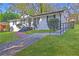 Quaint home featuring white painted brick and a green lawn at 3001 Will Rogers Se Pl, Atlanta, GA 30316