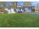 Beautiful home with lush green lawn and classic design elements at 3001 Will Rogers Se Pl, Atlanta, GA 30316