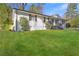 Classic home with a freshly cut lawn, white brick and black trim at 3001 Will Rogers Se Pl, Atlanta, GA 30316