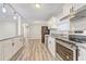 A kitchen view showcasing granite countertops, white cabinets, and stainless steel appliances at 3001 Will Rogers Se Pl, Atlanta, GA 30316