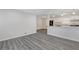 Living room featuring modern gray laminate flooring and direct view to kitchen at 3001 Will Rogers Se Pl, Atlanta, GA 30316