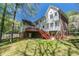 Expansive backyard with a deck and beautiful green space is an entertainer's delight at 3590 Lester Sw Ct, Lilburn, GA 30047