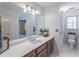 Bathroom vanity featuring mirror and sink at 3590 Lester Sw Ct, Lilburn, GA 30047