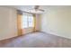 Carpeted bedroom with window and natural light at 3590 Lester Sw Ct, Lilburn, GA 30047