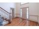 Bright foyer with hardwood floors and a staircase showcasing neutral tones at 3590 Lester Sw Ct, Lilburn, GA 30047