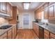 A kitchen featuring wood cabinets, granite countertops and stainless steel appliances at 3590 Lester Sw Ct, Lilburn, GA 30047