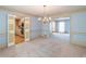 Spacious living room area featuring carpet and classic trim and molding details at 3590 Lester Sw Ct, Lilburn, GA 30047