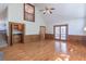 Bright living room with a fireplace, hardwood floors, and convenient wet bar at 3590 Lester Sw Ct, Lilburn, GA 30047
