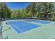 Enjoy outdoor recreation on these well-maintained tennis courts surrounded by lush greenery at 3590 Lester Sw Ct, Lilburn, GA 30047