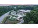 Scenic aerial view of community buildings, playground, and lush green surroundings at 636 Silva St, Cumming, GA 30040