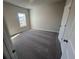 Neutral bedroom with a window and carpeting at 636 Silva St, Cumming, GA 30040